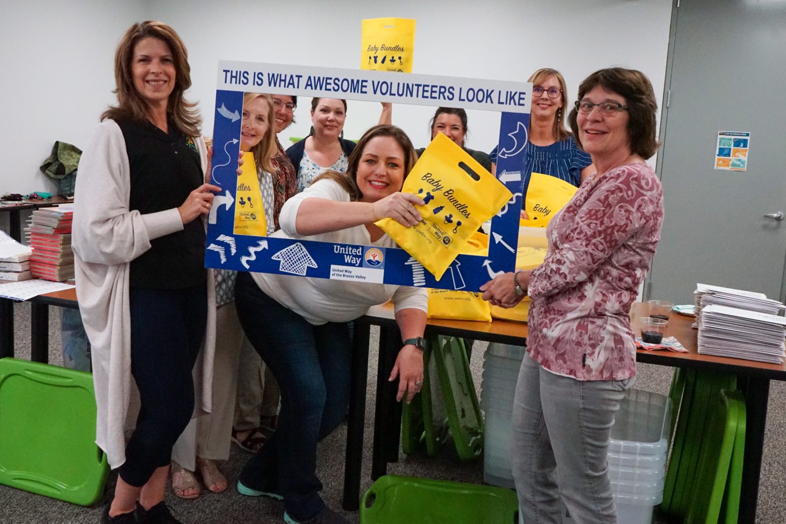 Volunteer with baby bundles